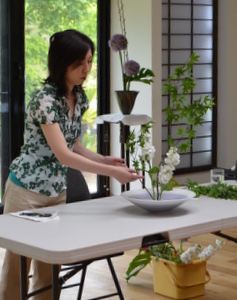 Yoko Loomba demonstrating the art of Japanese flower arranging known as Ikebana