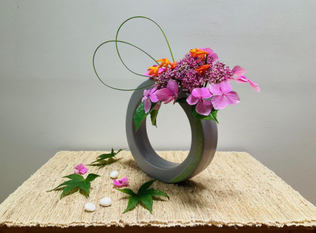 Ikebana, the Japanese art of flower arrangement, is where we choose various materials showing best of their elements at the time and placing them together towards the desired theme of the composition